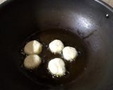 A picture of step 4 of Dal pakori in green curd.