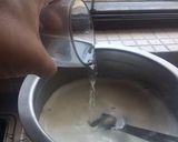 A picture of step 1 of Kesari Rasmalai topping with crunchy nuts.