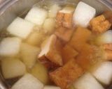 A picture of step 4 of Simmered Daikon & Atsuage Seasoned With Consomme.