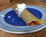 A picture of step 16 of Seasoned Chicken & cheese wrap with bell peppers and sour cream..
