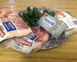 A picture of step 1 of Jalapenos wrapped in bacon.