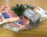 A picture of step 1 of Jalapenos wrapped in bacon.