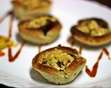 A picture of step 4 of Bbq Paneer in toasted cups.