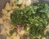 A picture of step 4 of Coconut green peas with potatoes.