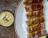 A picture of step 10 of Banana French toast roll ups with peanut sauce. #breakfastideas.