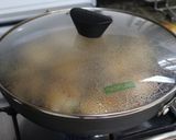 A picture of step 4 of Filipino Chicken Adobo Simmered in Coconut Milk.