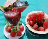 A picture of step 5 of Watermelon Mojito with blue Curacao.