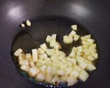 A picture of step 2 of Poha with Potatoes Peas and Pomegranate.