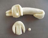 A picture of step 7 of Dog-Shaped Bread Rolls: Sleeping Dachshund Wiener Sausage Bread.