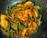 A picture of step 3 of French beans potatoes and peas curry in African style.