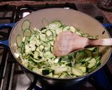 A picture of step 3 of Risotto with thick slices of zucchini.