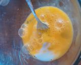 A picture of step 2 of 3 egg and cheese omelette.