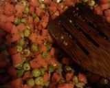 A picture of step 3 of Spicy garlic rice with peas and carrots.