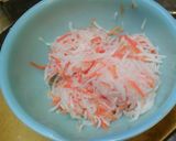 A picture of step 2 of Celebratory Red and White Namasu (Marinated Daikon and Carrot Salad) for New Year's.