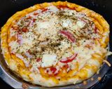 A picture of step 3 of Paneer and onion pizza.
