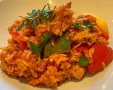 A picture of step 5 of Spanish style tomato and chicken baked rice.