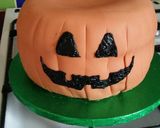 A picture of step 13 of Vickys Halloween Pumpkin Piñata Cake, Decorating Idea.