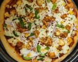 A picture of step 6 of Paneer Veggie Delite Pizza.