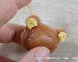 A picture of step 10 of Charaben Rilakkuma made from Mini Sausages.