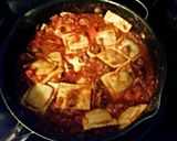 A picture of step 4 of Tinklee's Easy Sausage Sauce and Frozen Ravioli.