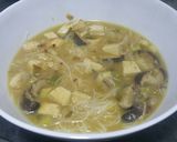 A picture of step 9 of Shitake miso soup with ginger and lime.