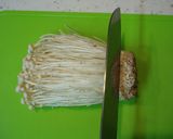 A picture of step 2 of How to Brush-Clean and Freeze Enoki Mushrooms.