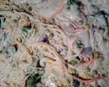 A picture of step 4 of mushroom Alfredo with veggies and canton noodles.