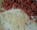 A picture of step 1 of Egg with summer sausage.