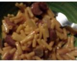A picture of step 6 of Mac & Cheese with fried onions and smocked sausage.