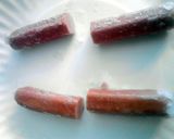 A picture of step 2 of Bloody Severed Fingers ( hot dogs with ketchup ) halloween.