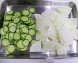 A picture of step 1 of Kids Love This! Simmered Cucumber & Daikon Radish.