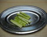 A picture of step 1 of Bacon Wrapped Broccoli Stems.