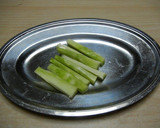A picture of step 1 of Bacon Wrapped Broccoli Stems.