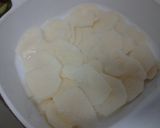 A picture of step 5 of Ladybirds Garlic & Sausage Potato Bake.