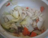 A picture of step 2 of Simmered Udon Noodle Hot Pot with Melting Cheese and Tomato.