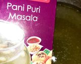 A picture of step 4 of Indian snack (crisp sphere with flavoured water/curd mixture).