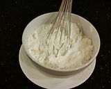 A picture of step 2 of Vanilla Layer Cake with Peppermint Whipped Cream Frosting and Filling.