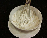 A picture of step 2 of Vanilla Layer Cake with Peppermint Whipped Cream Frosting and Filling.