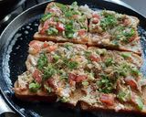 A picture of step 6 of Garlic Brown Bread mix vegetables cheese mini bread pizza.