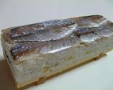 A picture of step 5 of Saba Oshizushi (Pressed Horse Mackerel Sushi).