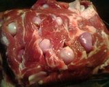 A picture of step 1 of Boston butt stuffed with shallots stove top.