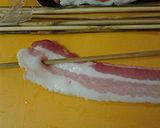 A picture of step 3 of Bacon wrapped kebabs.