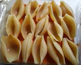 A picture of step 4 of Cheesy Chicken Alfredo stuffed shells.