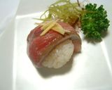 A picture of step 11 of Simple Temari Sushi Using a Pack of Sashimi.