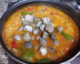 Foto del paso 19 de la receta: Arroz con jugos de cigalas, almejas y pimientos tipo padrón