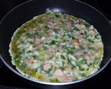 A picture of step 4 of Onion and sausage omelette.