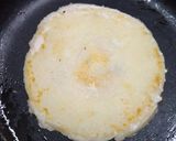 A picture of step 4 of Stuffed rawa utappam.