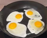 A picture of step 2 of Basil Fried Eggs.