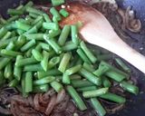 A picture of step 5 of Sig's Beans with Onions and Pine Nuts.