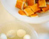 A picture of step 1 of Sweet and Salty Simmered Satsuma-Age and QuailEggs.